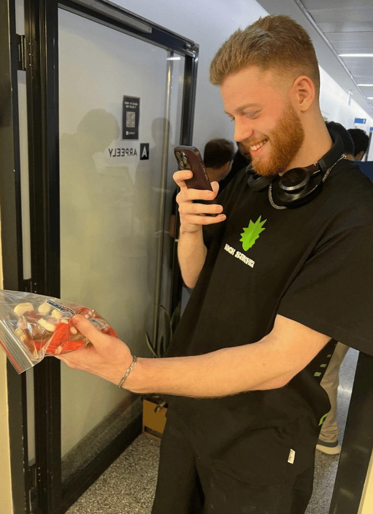Anders brand wordmark in white placed on top of an image of a modern interior design.