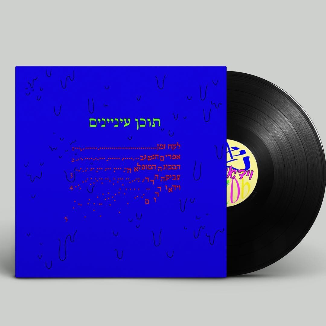 Photo of a man in a room using a tablet computer